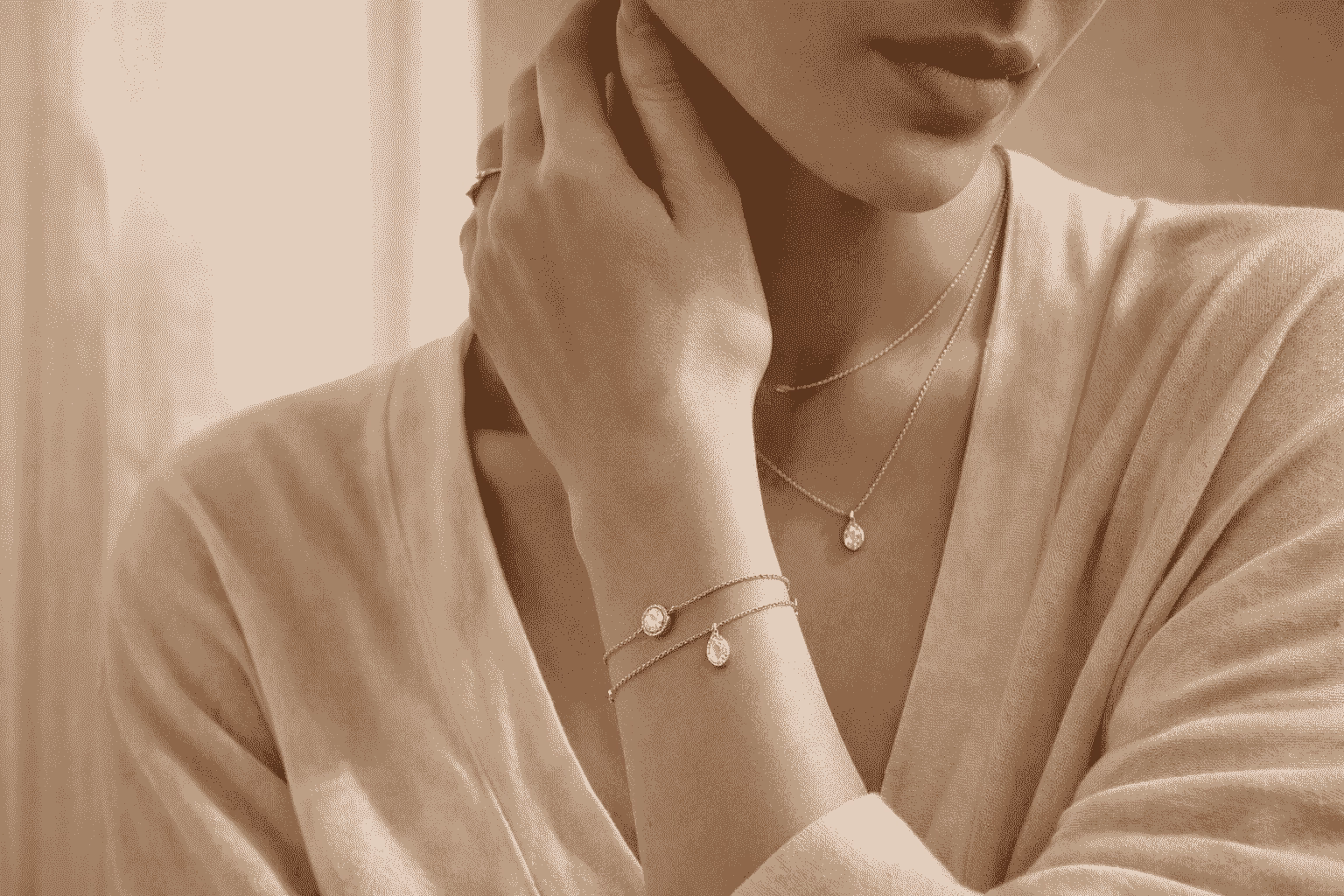 Woman wearing luxury fine jewelry on wrist and hand
