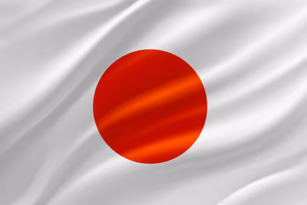 Flag of Japan with a red circle centered on a white background with fabric folds.