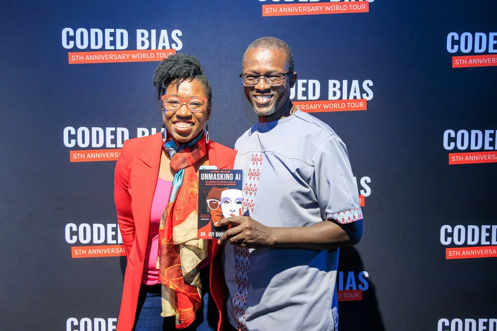 Guests in front of Coded Bias backdrop
