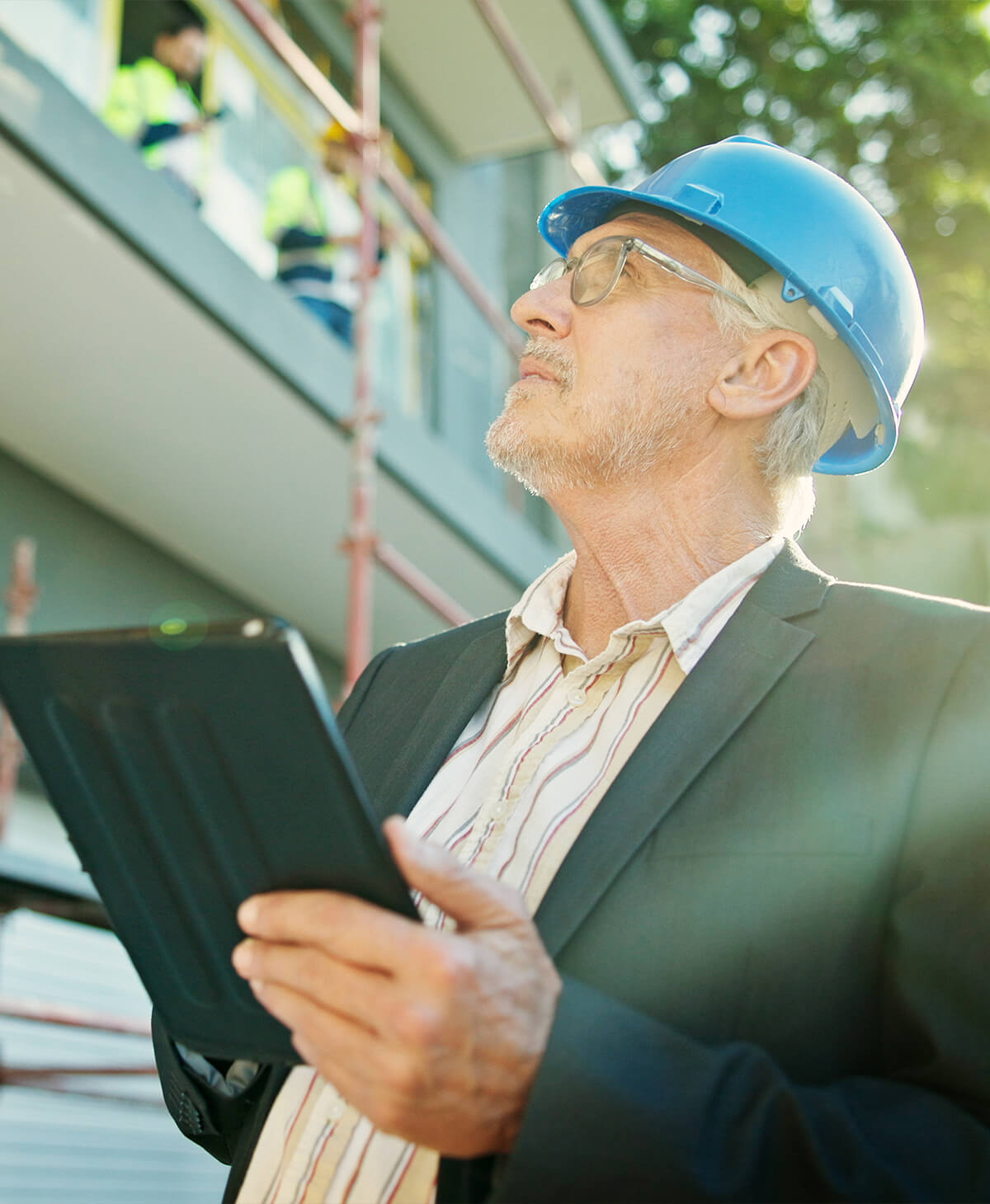 Business owner looking at building in construction