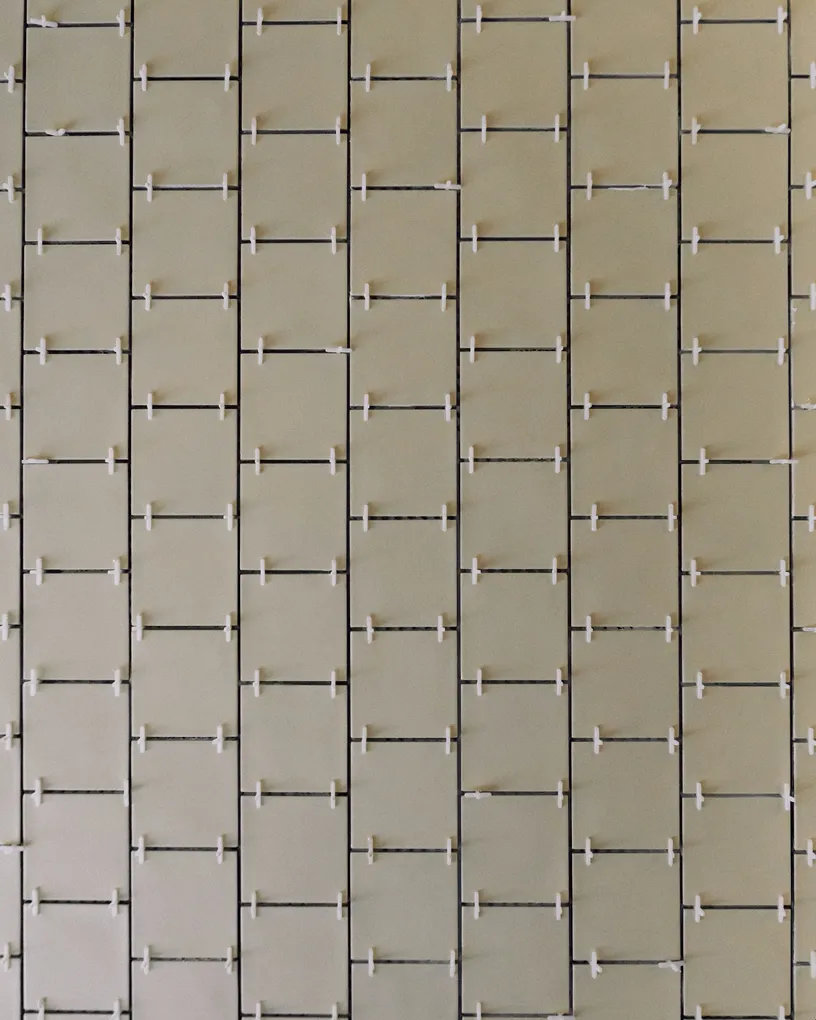 Precision tile installation process using spacers for accurate alignment and premium finishes.
