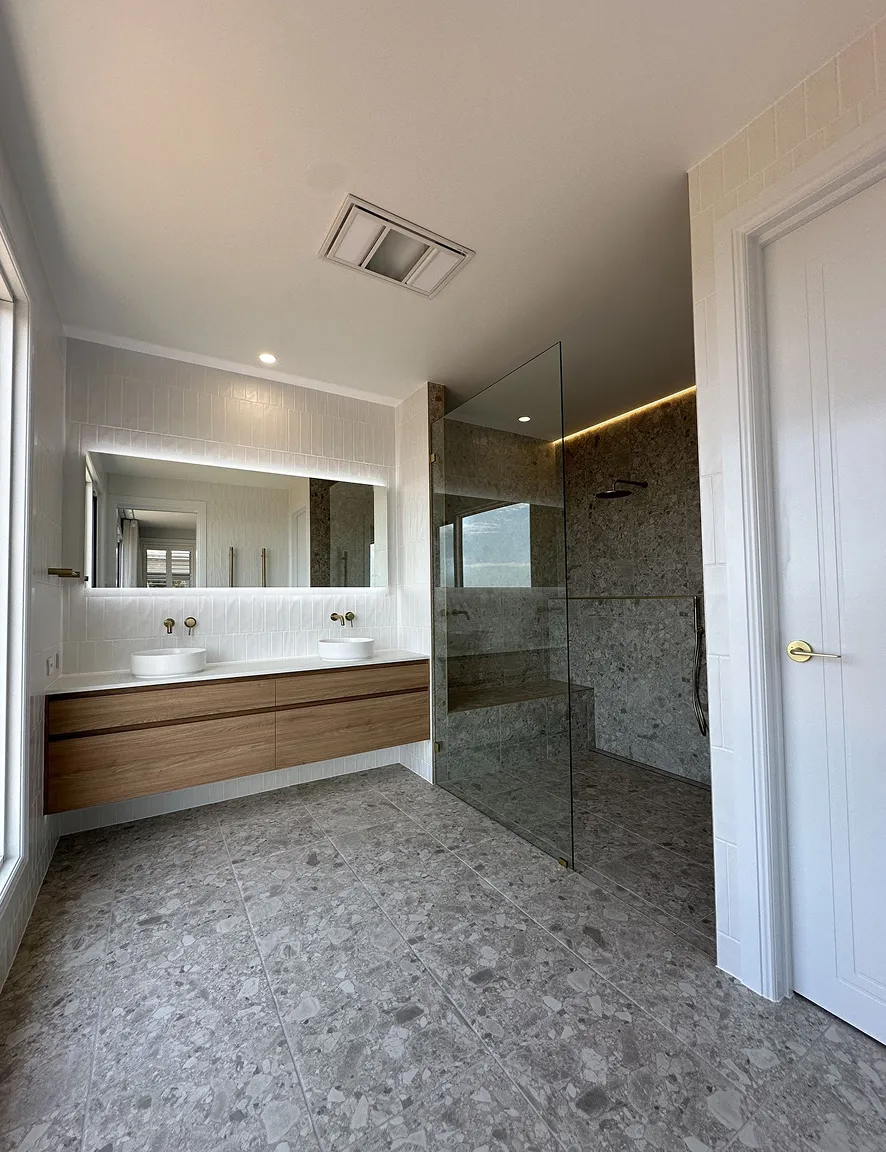 Luxury bathroom featuring premium floor and wall tiling with custom finishes and expert workmanship.