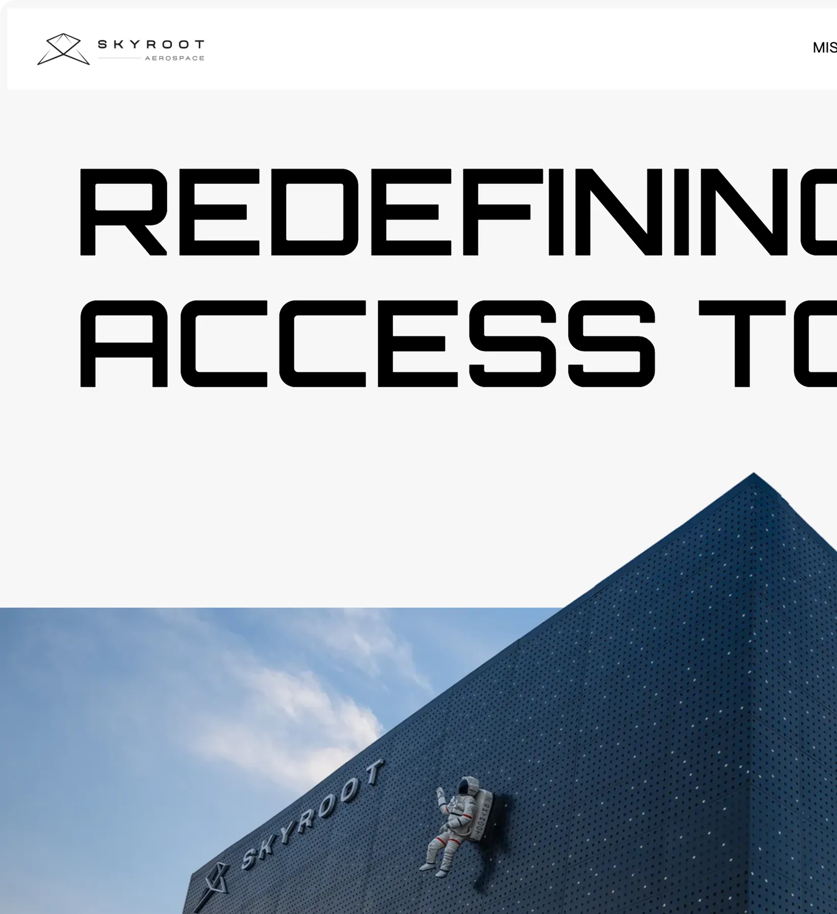 Building facade with SkyRoot Aerospace logo and a mounted astronaut figure waving against a blue sky.