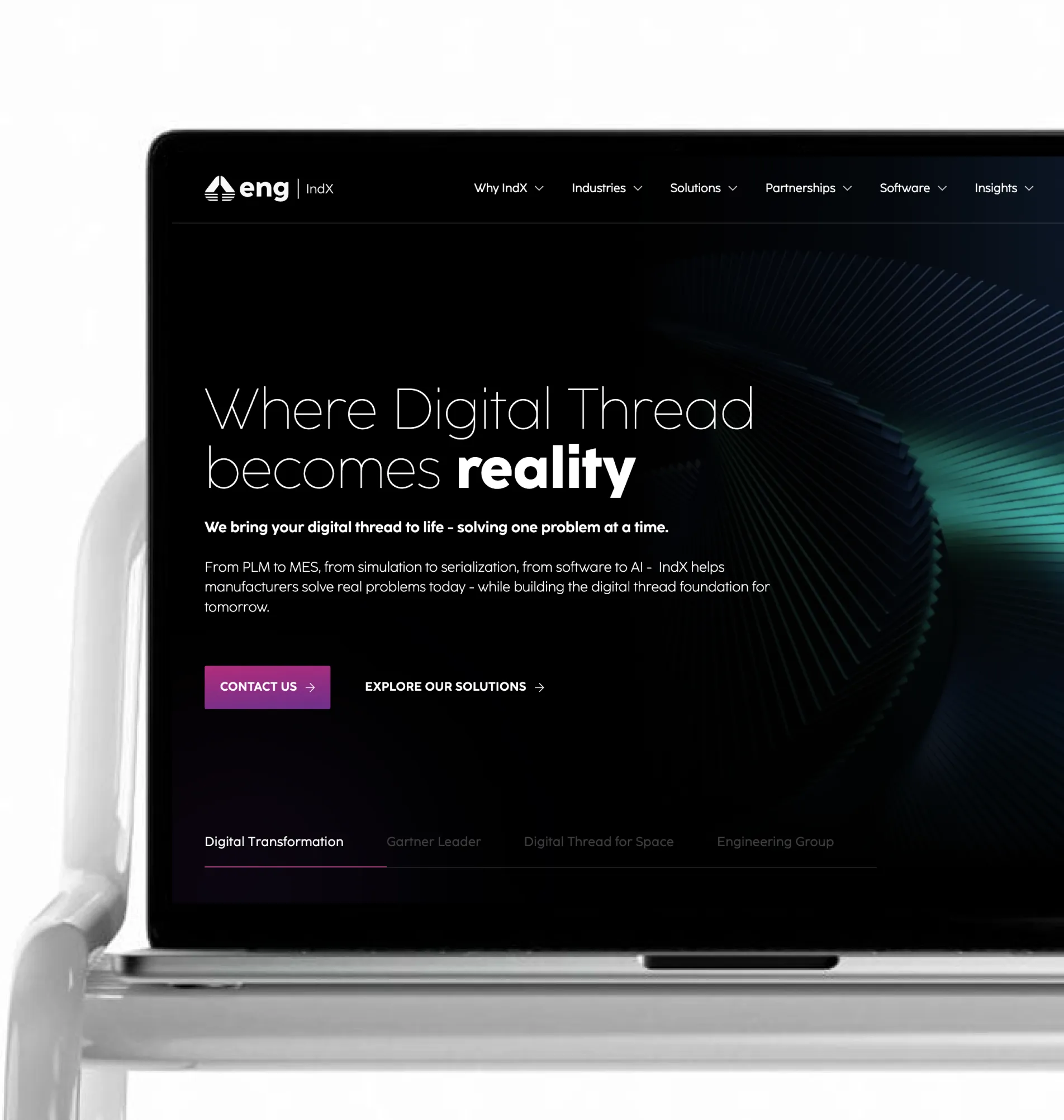 Laptop screen showing eng IndX website homepage with tagline about digital thread becoming reality.