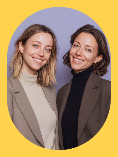 A smiling professional woman working on a laptop against a purple background, representing productivity and a positive hiring experience.