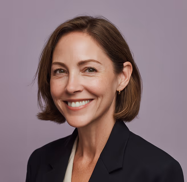 A formally dressed woman smiling confidently, conveying professionalism and trust in recruitment services.