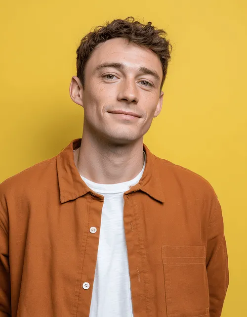 A casually dressed man smiling, reflecting an approachable candidate and a positive hiring experience.