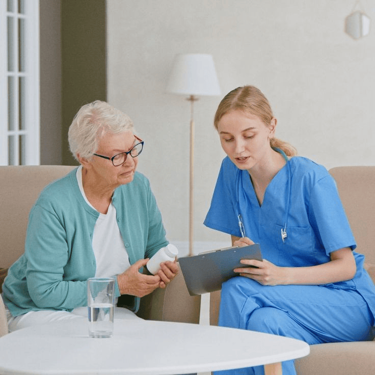 Women going through assessment with elderly women in her house.