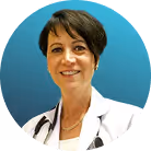 female podiatrist smiling in clinic