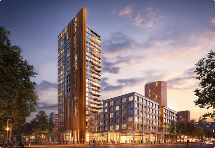 Mischnutzungshochhaus bei Sonnenuntergang – modernes Architekturbeispiel und erfolgreich umgesetztes Stadtprojekt von Puentes Real Estate.