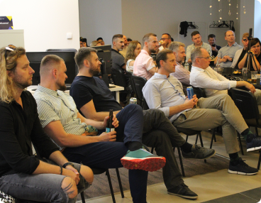 Group of people seated in chairs participating Gate Event