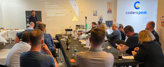 Group of people attending a presentation in Gate Event