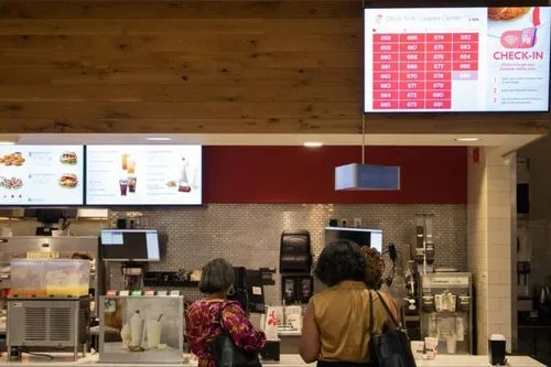 Customers ordering food in a QSR