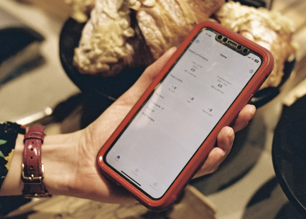 Cafe employee using Nory mobile app