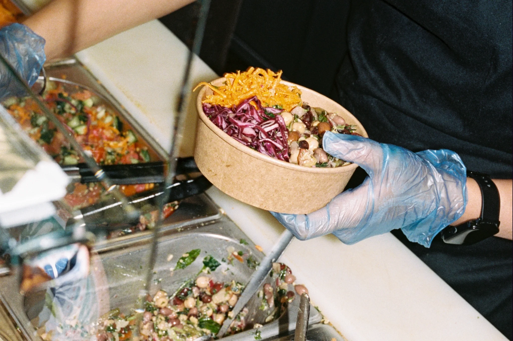 Serving food at Eat a Pitta