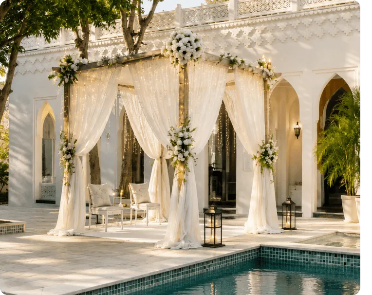 White floral canopy with drapes set up poolside for a wedding
