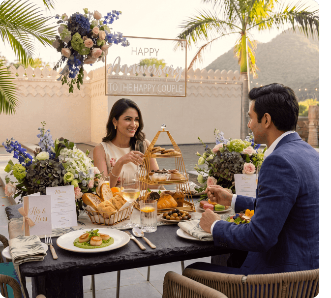 Couple dining outdoors at a floral-decorated anniversary table