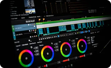 Color grading workstation with video scopes and color wheels during post-production