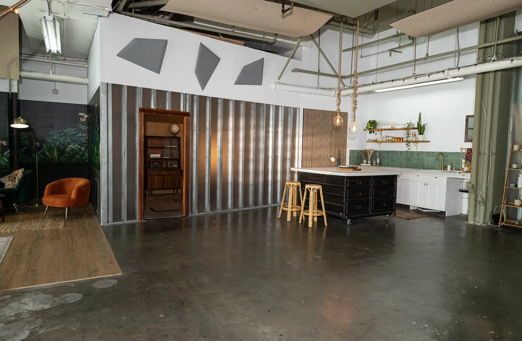 STMNT Studios modern kitchen set with concrete countertops and corrugated metal backdrop