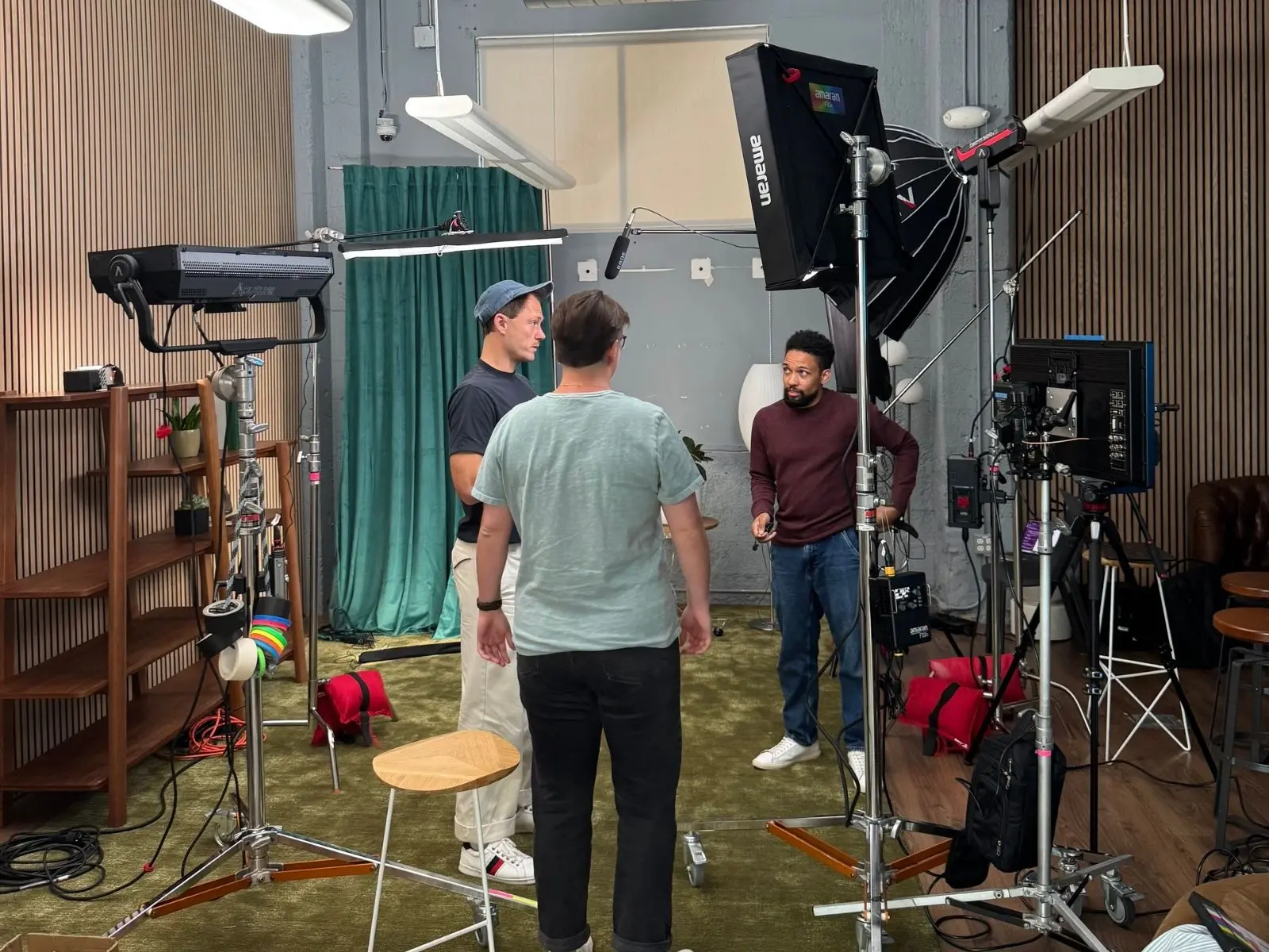 STMNT and Plaid teams reviewing the lighting and camera setup together on the studio floor