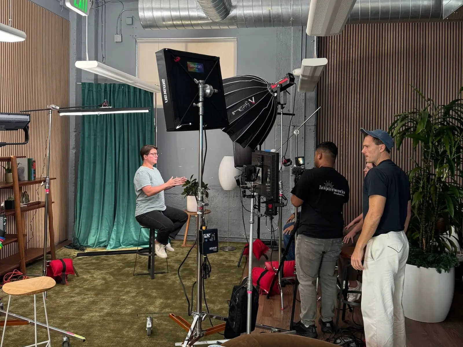 STMNT Studios director guiding an on-camera interview on set for Plaid's Woven brand campaign