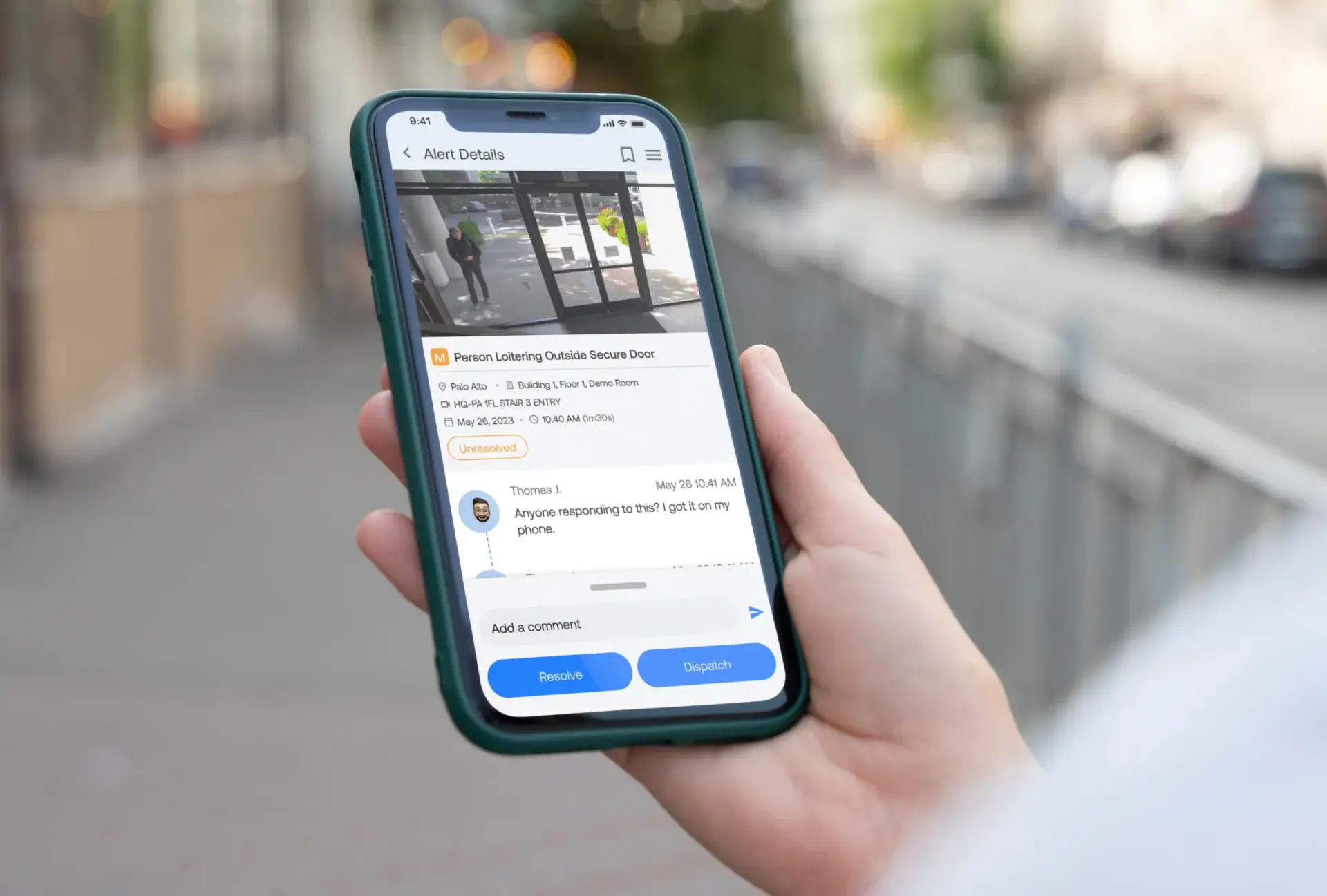 A person holding a cell phone in their hand.