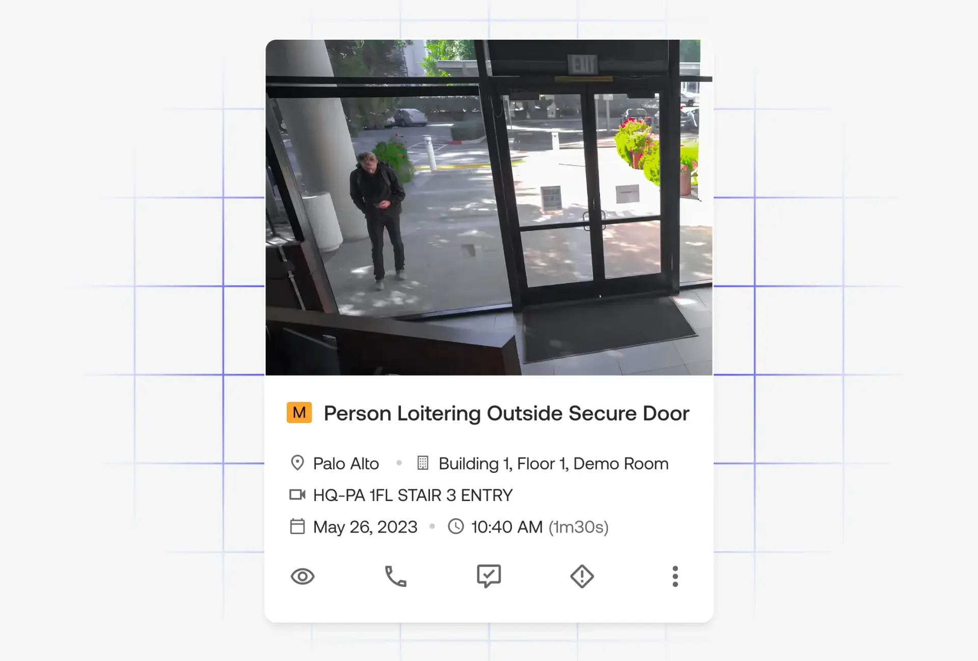Security alert screen showing a person loitering outside a secure glass door in a building lobby.
