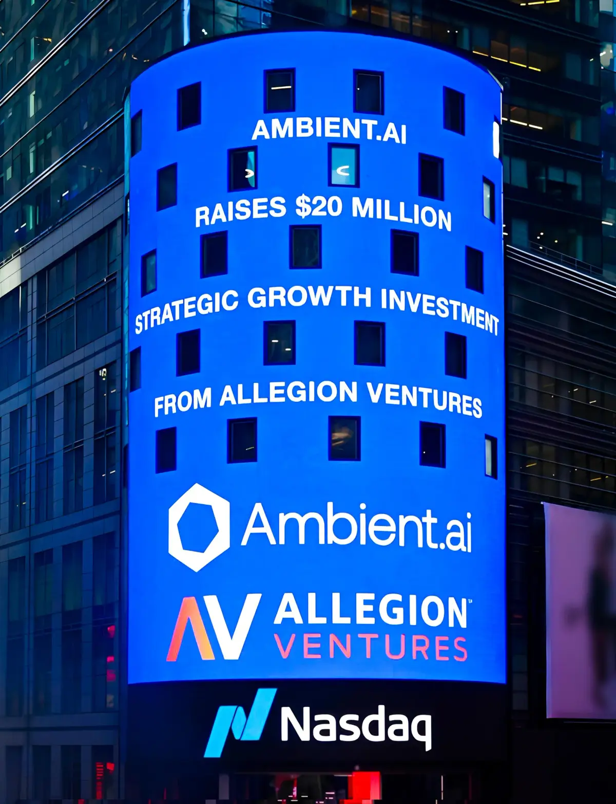 Blue digital billboard announcing Ambient.ai raises $20 million strategic growth investment from Allegion Ventures with logos of Ambient.ai, Allegion Ventures, and Nasdaq.