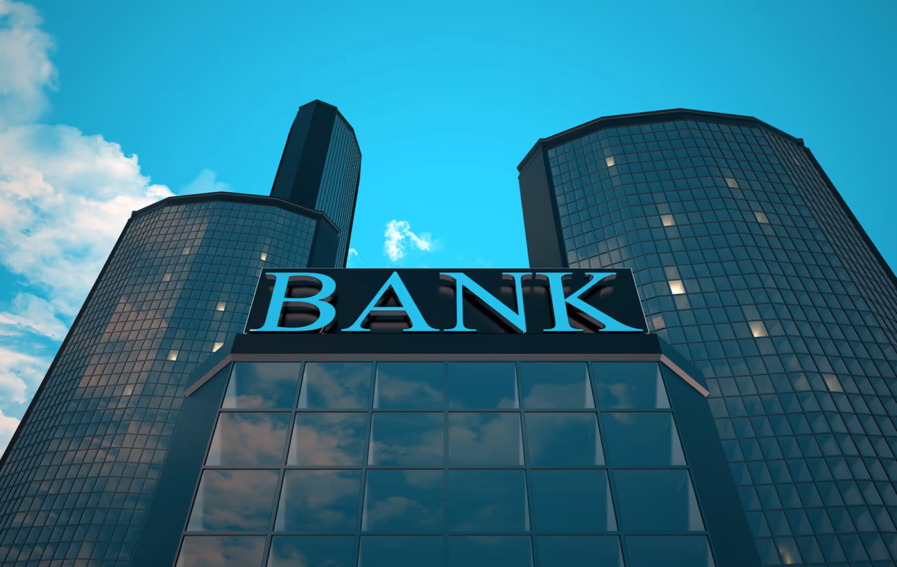 Modern bank building with reflective glass windows and tall skyscrapers in the background under a blue sky.