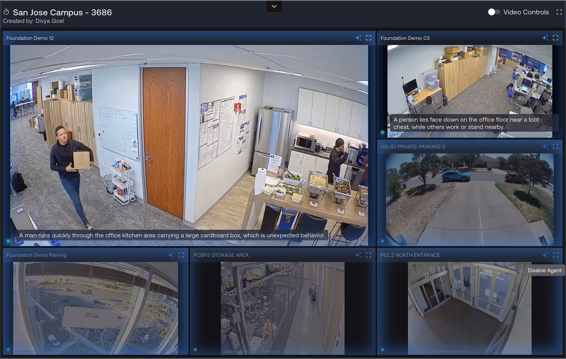 Security camera dashboard showing multiple views: a man running quickly through an office kitchen carrying a large cardboard box, a person lying face down on an office floor near a tool chest with others nearby, outdoor parking area with cars, a storage area corridor, and an office building's north entrance.