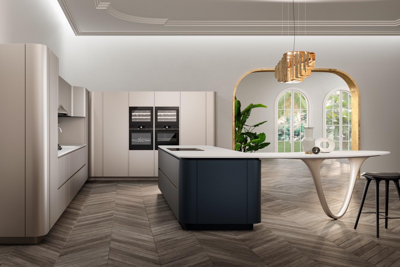 Snaidero Ola kitchen with beige cabinets, dark island with white countertop, integrated ovens, and a unique curved table supported by a sculptural leg.