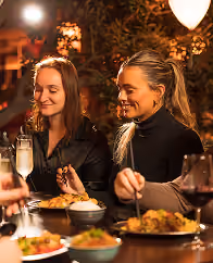 Guests sharing dinner at Mama Yo