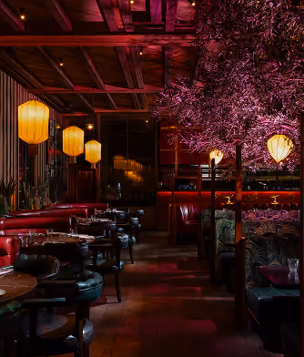 The dining room at Mama Yo with lanterns and blossom