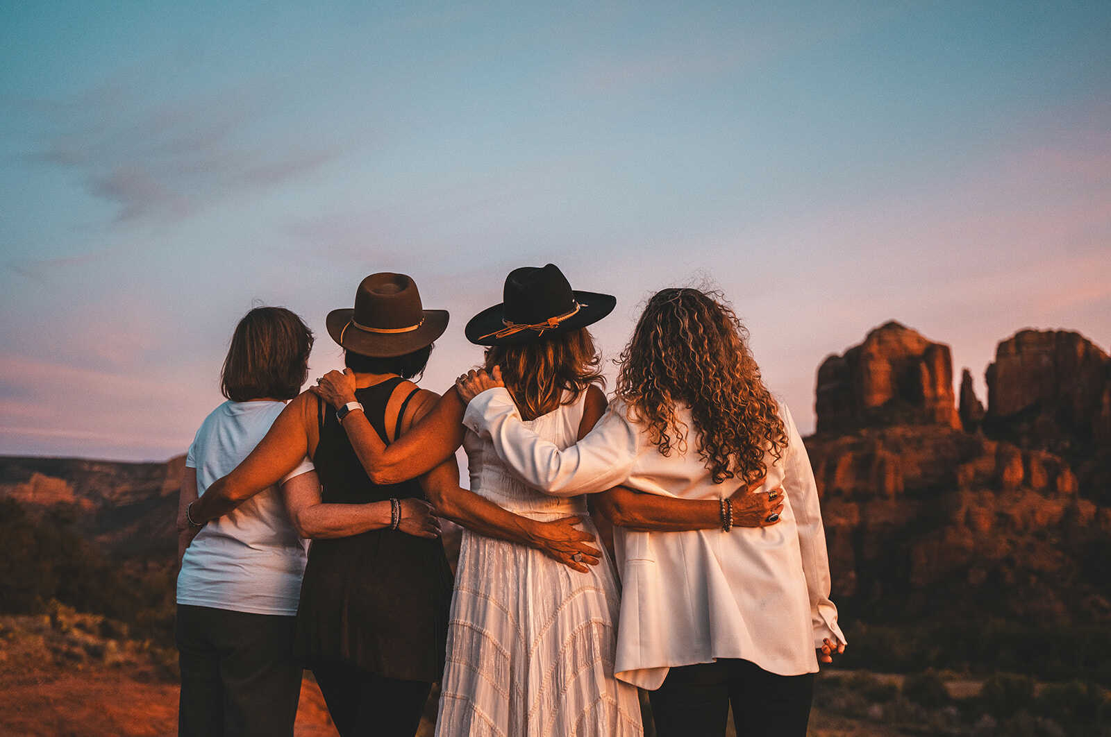 Women embracing at sunset in Sedona