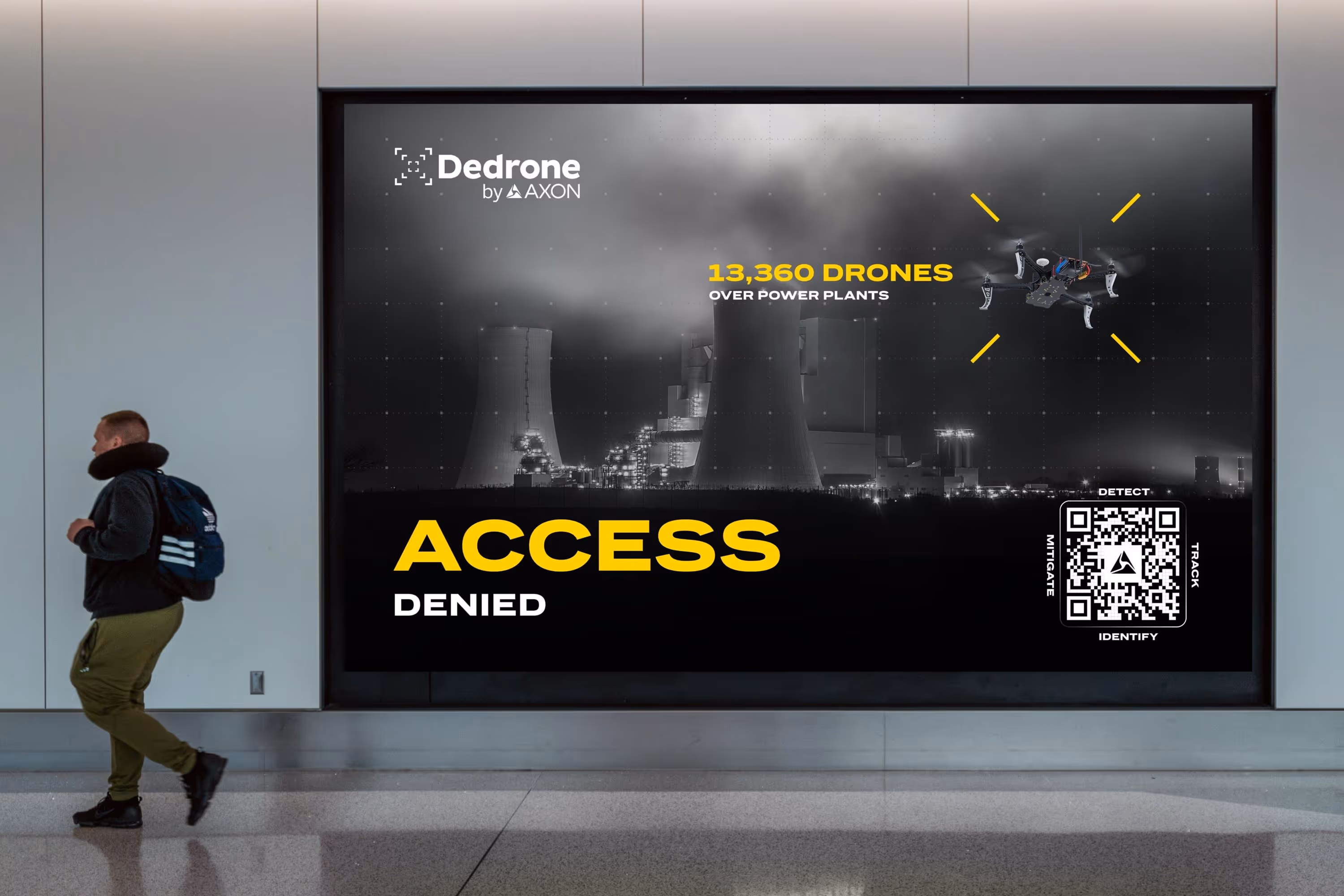 Large advertisement showing a drone over a power plant with text '13,360 drones over power plants' and bold text 'ACCESS DENIED' with a QR code beside it.