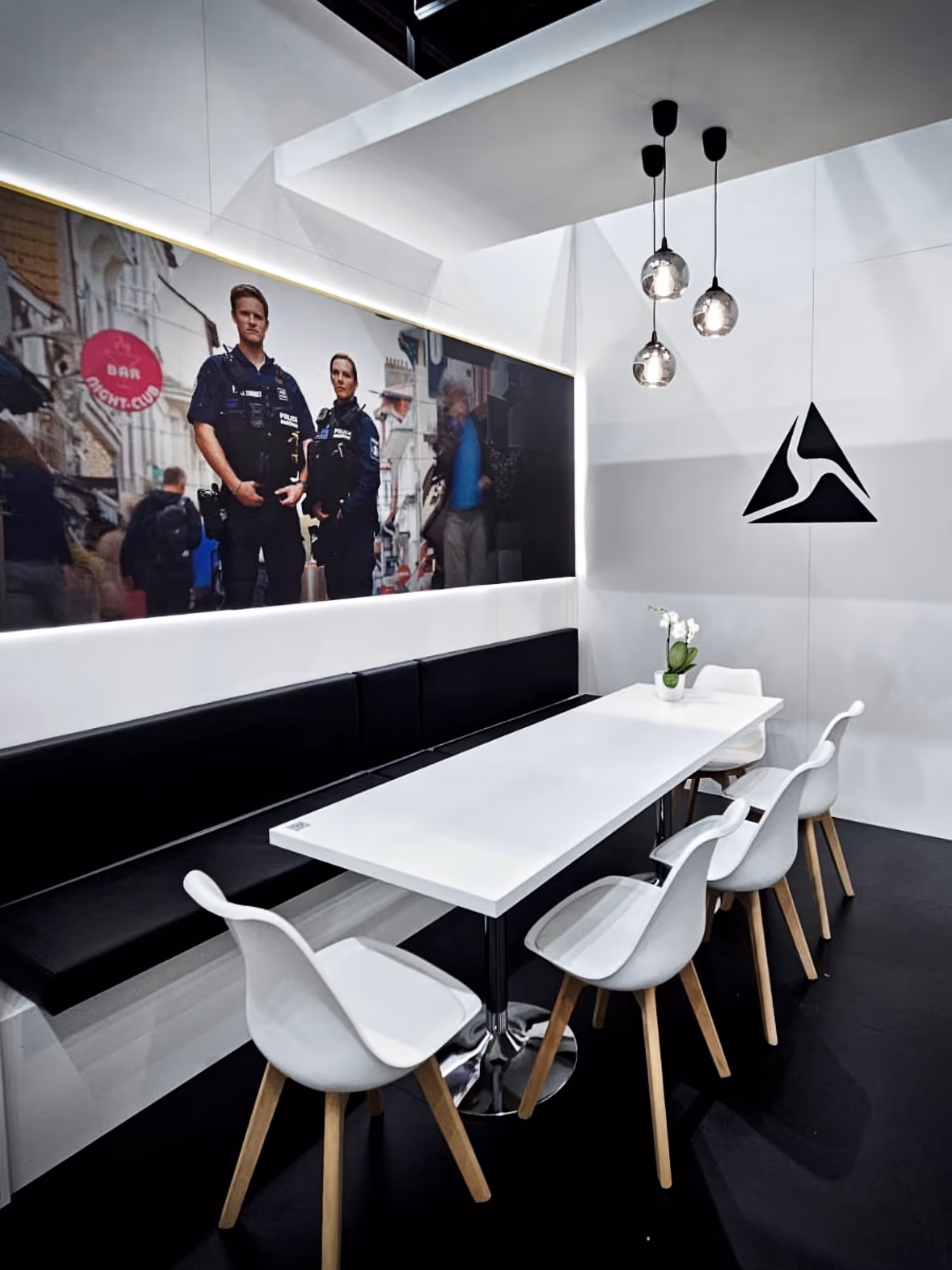 Two soldiers in tactical gear aiming rifles behind a protective digital shield as three drones fly in dark smoky sky.