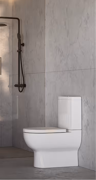 Modern white toilet installed against a marble wall in a minimalist bathroom with a black shower fixture.