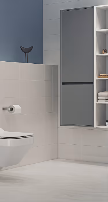 Modern bathroom corner with a wall-mounted toilet, toilet paper holder, grey cabinet, and open shelving with towels and toiletries.