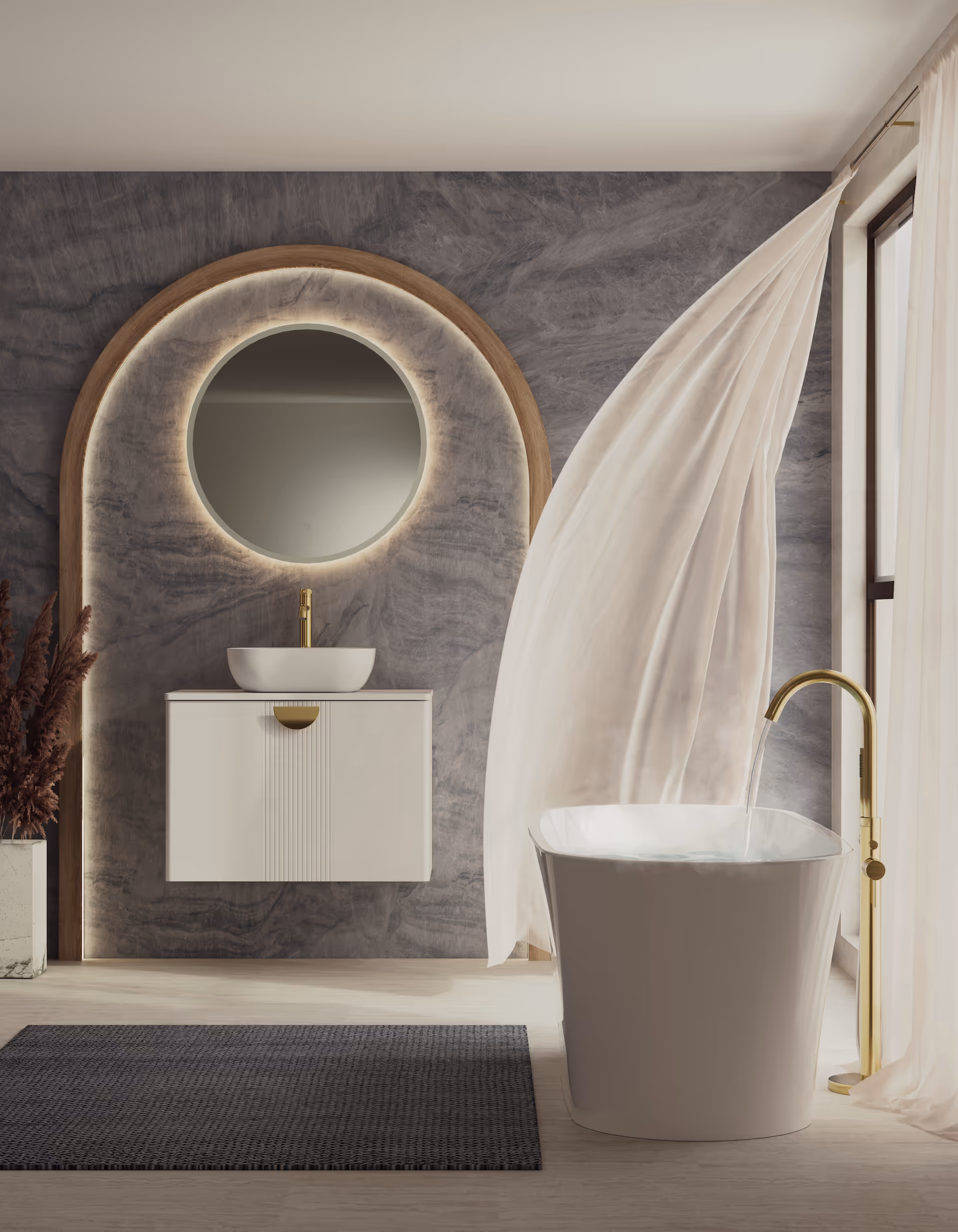Modern bathroom with freestanding white bathtub filled with water, gold faucet, floating vanity with vessel sink, round backlit mirror, and sheer curtains blowing by the window.