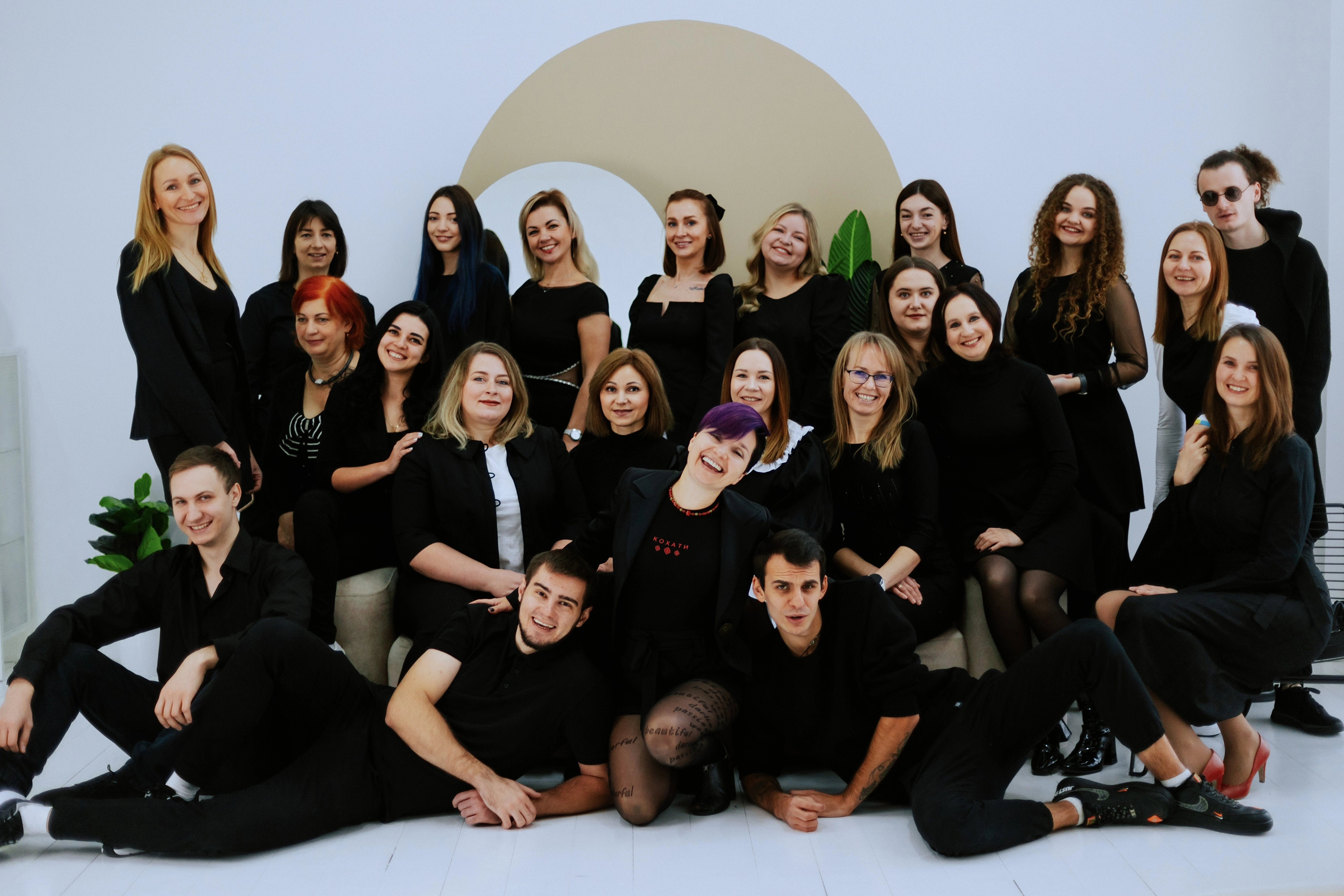 ThinkGlobal school teachers and staff team together with Yana Moskovchenko during a group photoshoot.