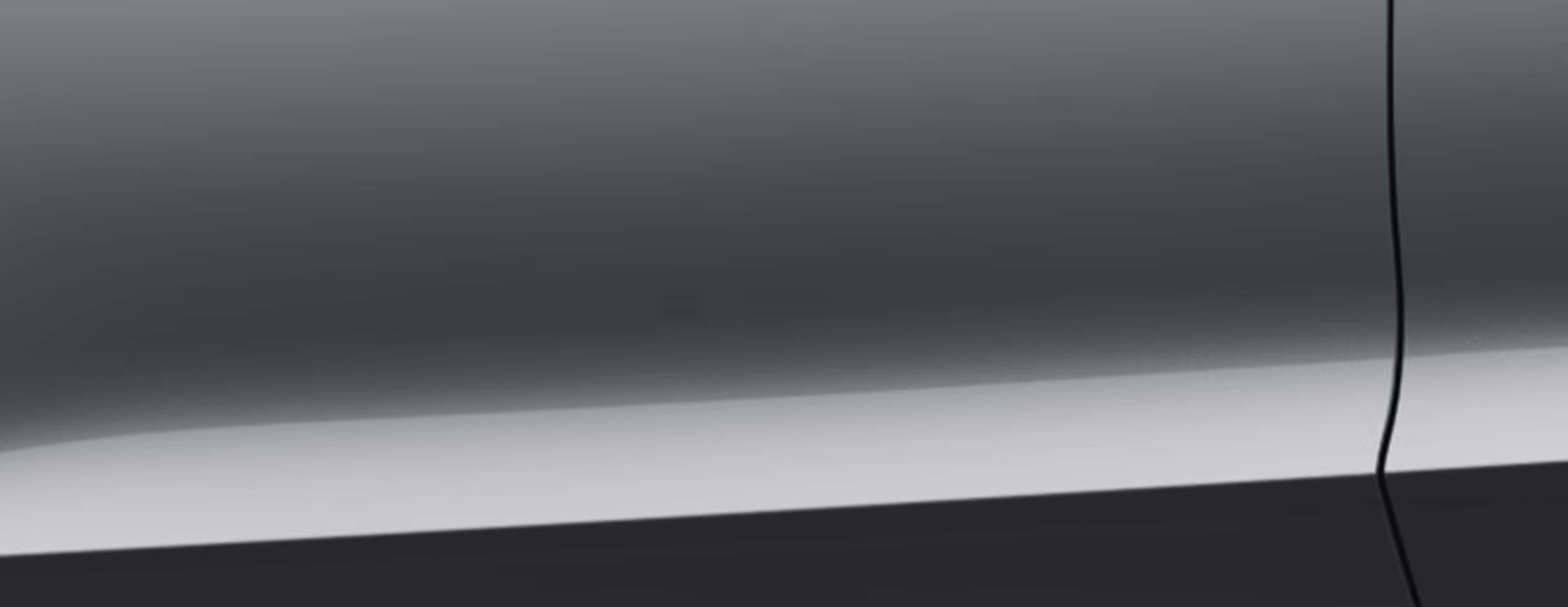 Eine minimalistische Detailaufnahme zeigt einen Ausschnitt der Karosserie des Škoda Scala Balance in der Lackierung Smokey Diamond-Silber Metallic. 
