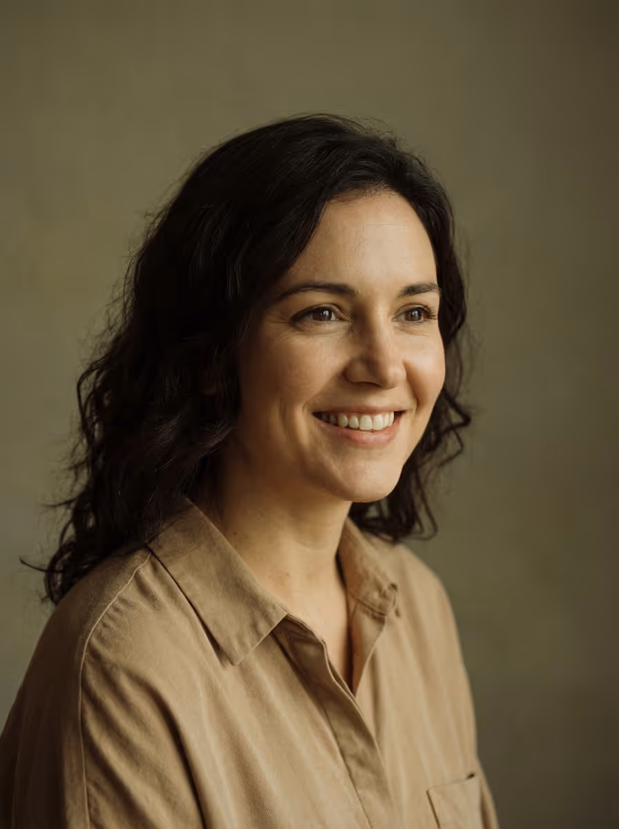 Portrait of a woman with curly dark hair