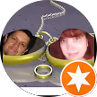 Circular profile picture showing two people smiling, partially overlaid with a white abstract shape and an orange star icon in the bottom right corner.