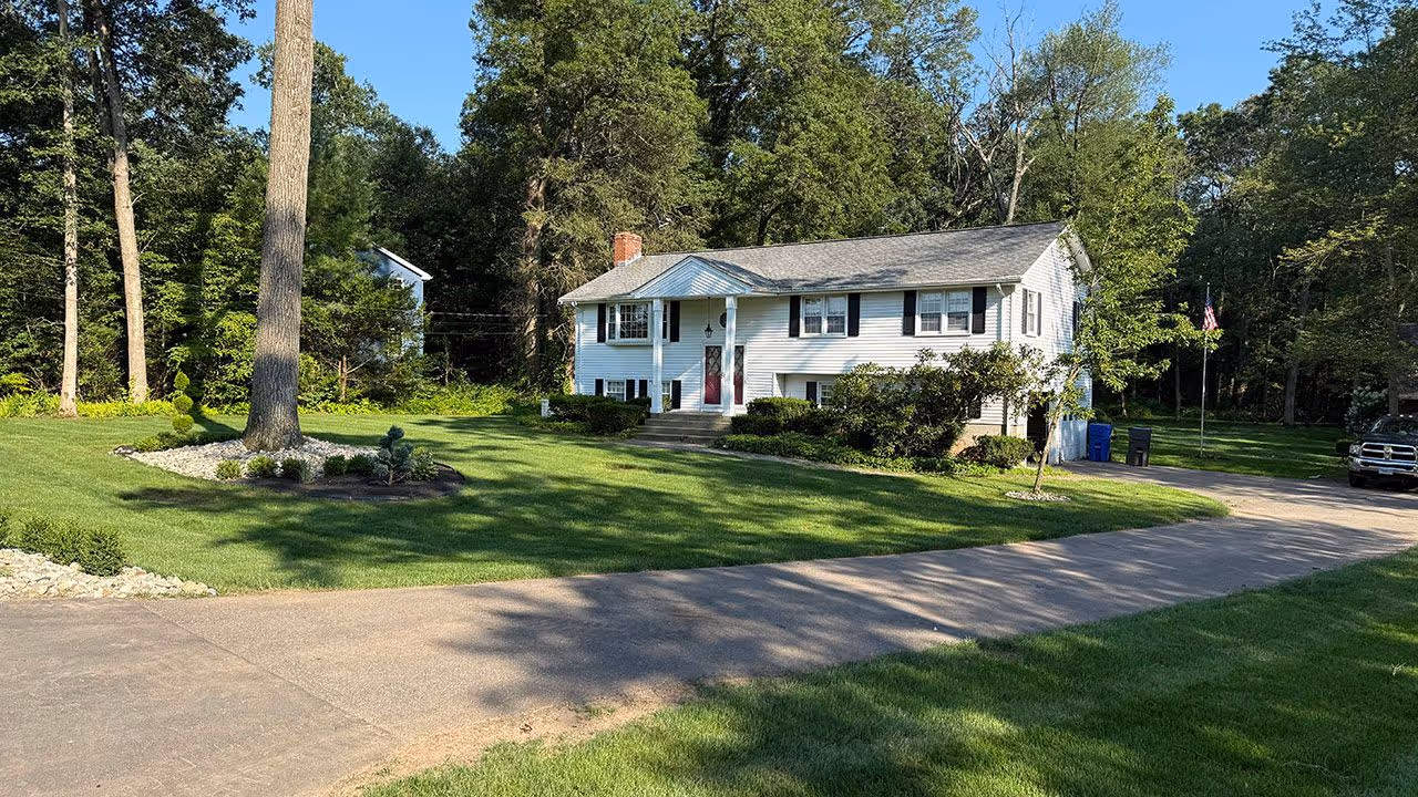Landscape enhancement featuring fresh plantings and clean bed lines completed by Earth Management Solutions LLC