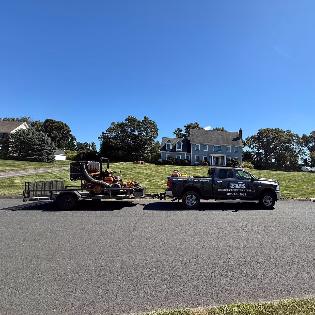 Professional landscaping crew at work Earth Management Solutions LLC