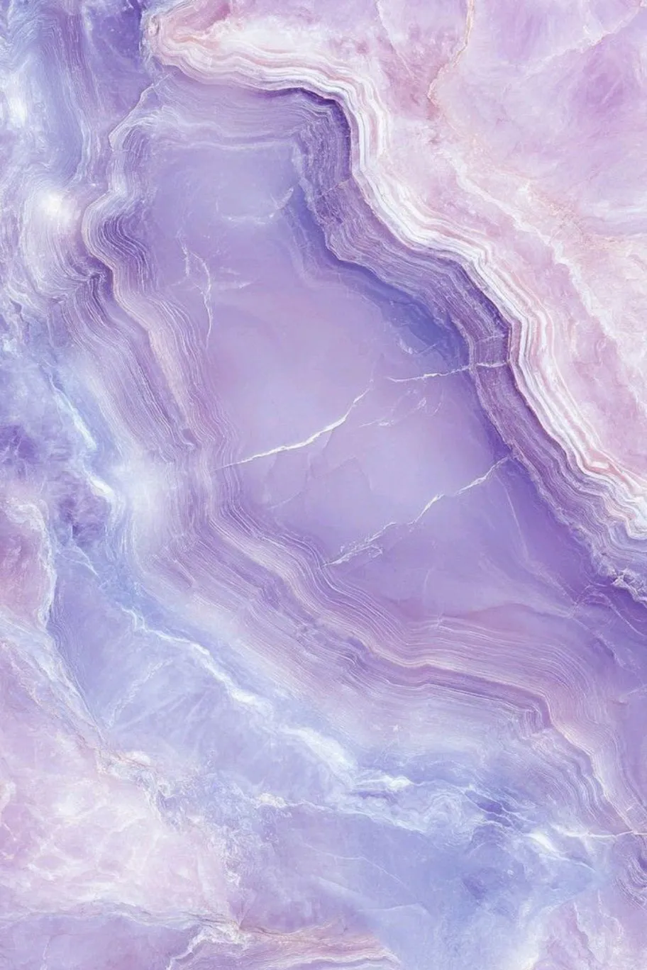 Close-up of purple and lavender agate stone with natural layered patterns and textures.