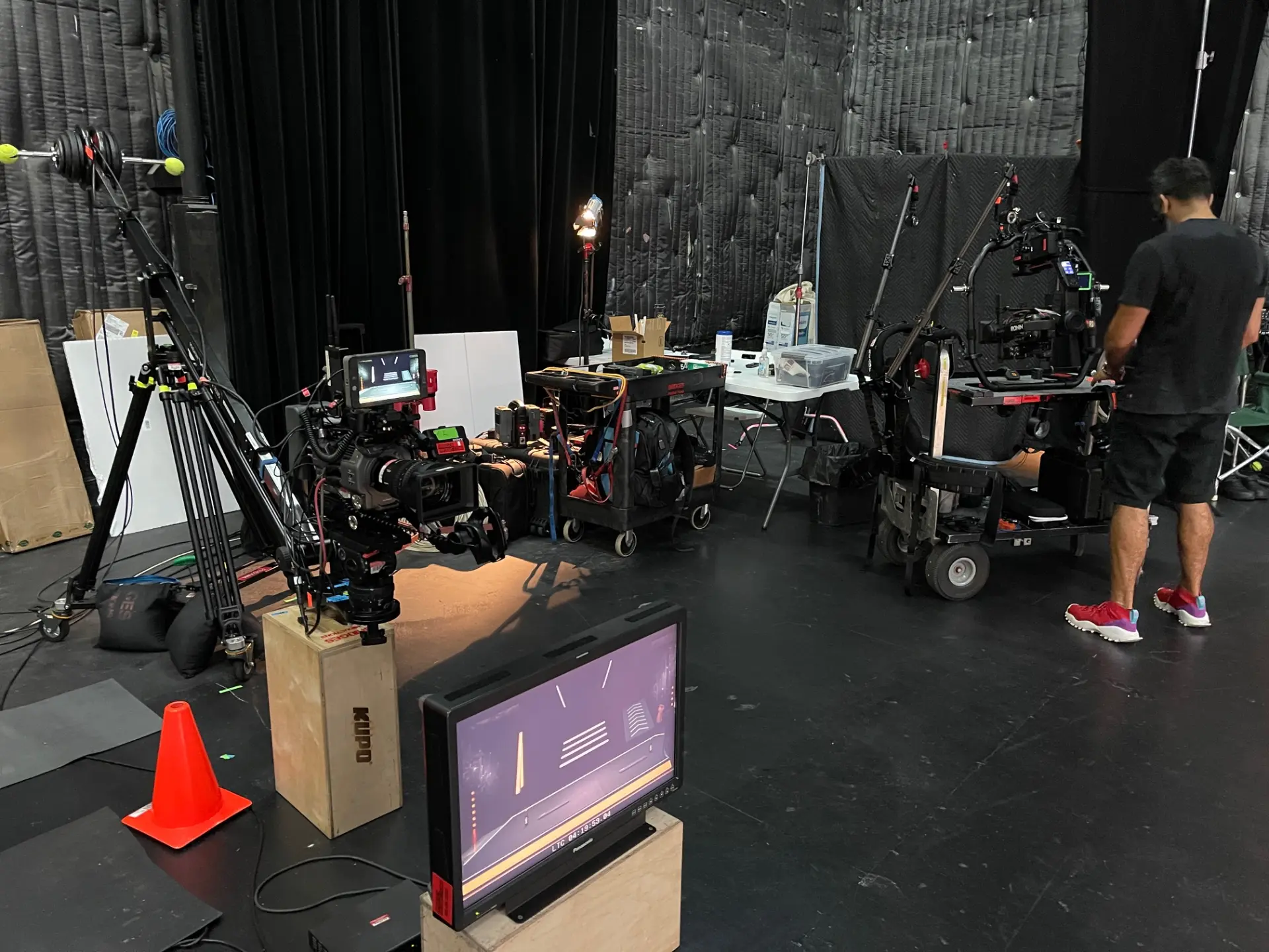 Professional film studio with cameras and equipment preparing for a tv commercial production.