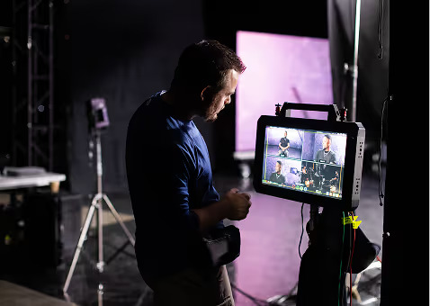 Videographer filming a scene during the video production stage