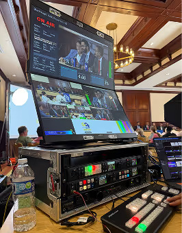 Live video switching and multi-screen monitoring setup at a professional broadcast event.