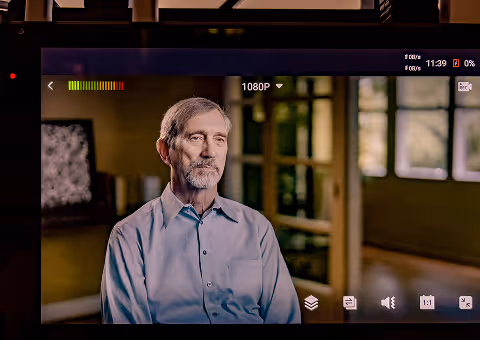 Executive speaking on camera during a SaaS testimonial video production shoot